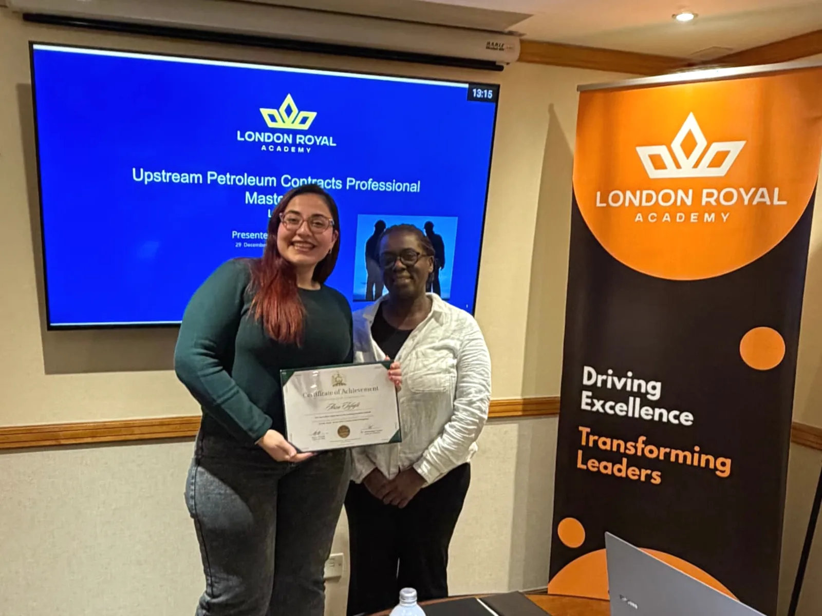 A learner receiving a certificate of achievement at the end of a London Royal Academy programme
